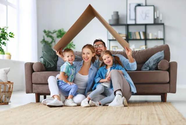 Happy Family Sitting in Living Room
