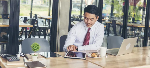 Man banking on iPad