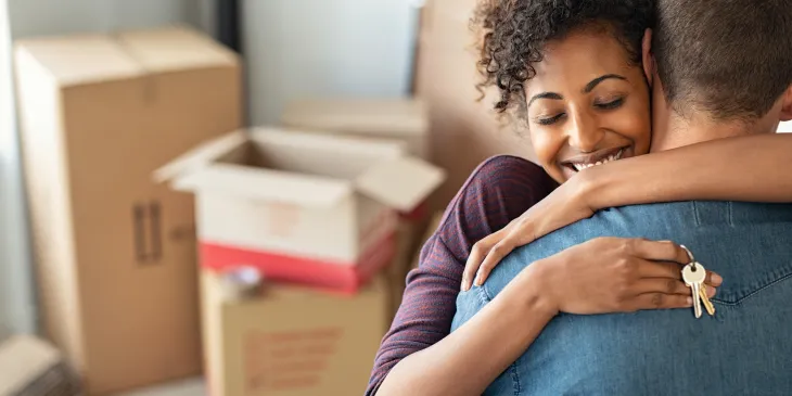 Couple Hugging Holding Home Keys