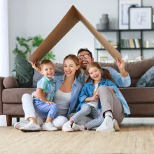 Happy Family Sitting in Living Room